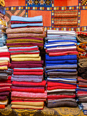 Chefchaouen, Morocco - 18 January 2022 : Colorful traditional silk and cotton fabrics in a Moroccan craft store