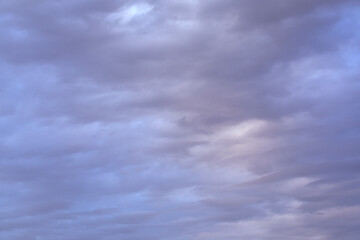 blue sky background with grey clouds. blue cloudy skies texture.