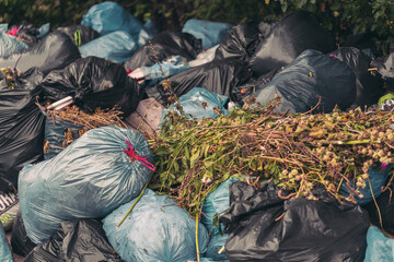 Closeup shot of a pile of trash bags - pollution concept