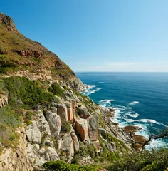 Foto auf Leinwand Seascape, landscape and scenic view of Hout Bay in Cape Town, South Africa. Blue ocean and sea with mountains and copyspace. Travel and tourism abroad and overseas for a summer holiday and vacation © SteenoWac/peopleimages.com