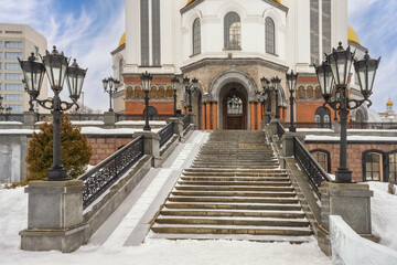 Stairs and openwork lanterns at the Church on the Blood in Yekaterinburg (Russia) in winter. Close-up.