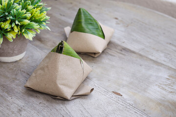 Famous Malaysian breakfast Nasi Lemak on the wooden table 