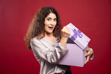 Young happy woman surprised about her gift