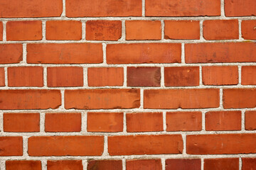 Closeup of a strong red brick wall and copy space on exterior of a home, house or city building....