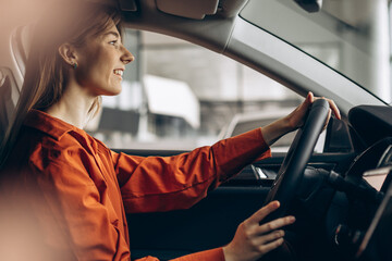 Woman sitting in her new car
