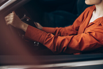 Woman sitting in her new car