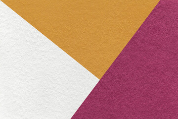 Texture of craft white, yellow and purple shade color paper background, macro. Structure of abstract wine cardboard