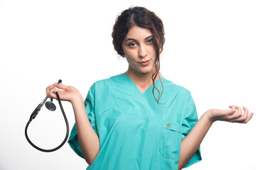 Female doctor with stethoscope on white background