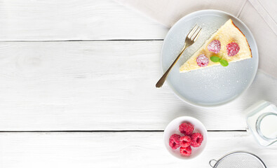 Background from boards with cheesecake on a plate