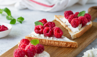 Toast with cheese and raspberries