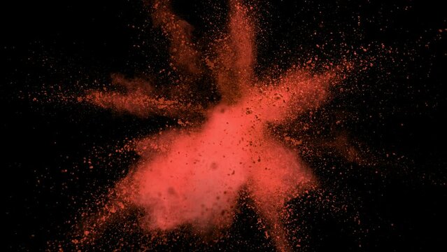 Super Slow Motion of Orange Powder Explosion Isolated on Black Background. Filmed on High Speed Cinema Camera, 1000fps.