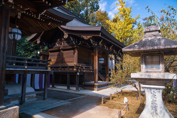 Avenue with shrines and stone lanterns at Poet's Festival Kitano Tenmangu in Kyoto, Japan.