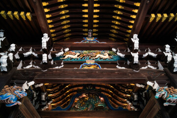 Beautiful architectural details and traditional Japanese iconography at Kitano Tenmangu Shrine at the Poets Festival in Kyoto, Japan. 