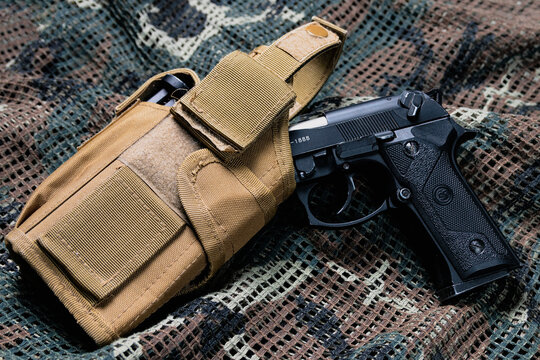 beretta pistol with tactical vest