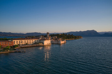 Obraz premium Sirmione on Lake Garda, Italy. Aerial view of Scaligero Castle at sunrise.
