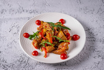 chicken meat and vegetable salad. on a light concrete background