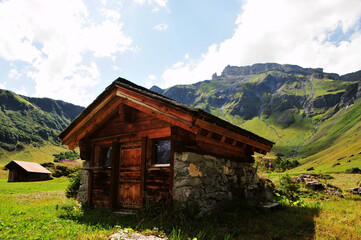 Traditional wooden houses in the valleys of the Swiss Alps