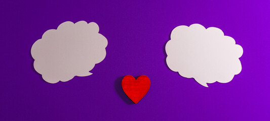 White clouds,heart for Valentine's day concept.Communication red heart between two clouds. Purple,veri peri background.Place for your text. Copy space.Banner.