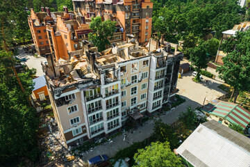 Fototapeta premium a house in Irpen destroyed by shells of Russian occupiers, drone view