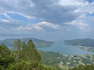 Fototapeta premium View from the top of the mountain with beautiful clouds and sunshine