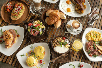 many mixed western breakfast food items on cafe table - 515370247