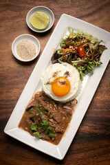 Traditional cambodian Lok Lak stir fried beef with rice meal