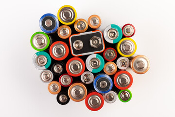 Composition with alkaline batteries on white background. Chemical waste. Top view.