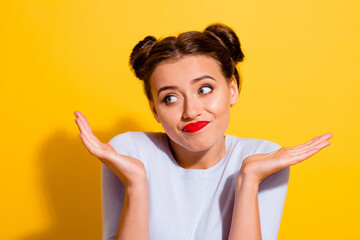 Photo of pretty hesitant young lady look blank space have misunderstanding with person isolated on yellow color background - obrazy, fototapety, plakaty