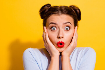 Photo of impressed astonished female see huge sales on black friday touch her cheeks isolated on...