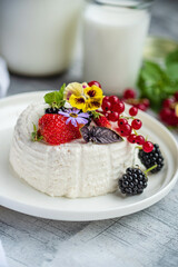 ..Fresh ricotta with berries and flowers