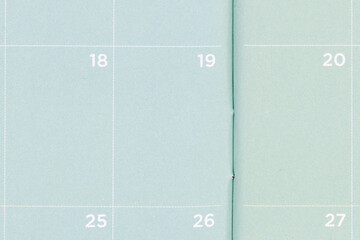 Close-up of a green pocket calendar that is blank