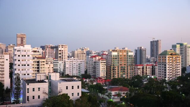 Cityscape of Santo Domingo downtown residential and office buildings in soft evening light, Dominican Republic. Static shot