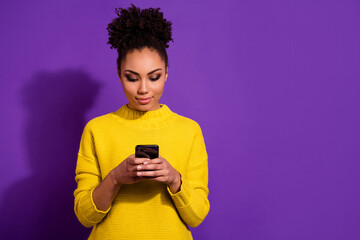 Photo of charming pretty person hold telephone typing message isolated on violet color background