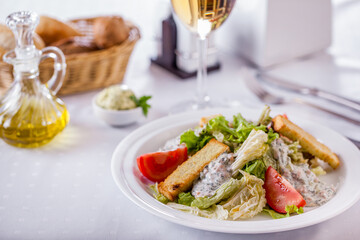 Salad with croutons, tomatoes, sour cream, dill and salad