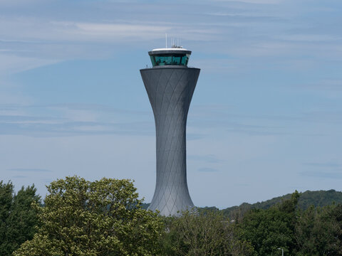 Air Traffic Control Tower Centre Image At Edinburgh Airport In UK. Blue Sky And Trees In View.