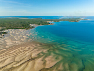 Aerial view over turquoise water  and sand waves at Catamaran Bay in the Kimberley of Western Australia
