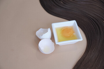 lock of silk hair and an egg, the concept of homemade shampoo, the benefits of eggs for hair