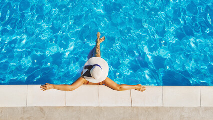  Carefree woman relaxation in swimming pool summer Holiday concept