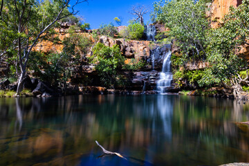 Idyllic Billabong with waterfall and Boab tree at Galvans Gorge in the Kimberley, Western Australia