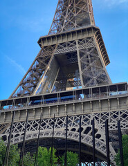 Close up of the Eiffel Tower on a spring day with blue sky in Paris, France