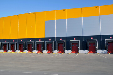 Modern warehouse complex. Warehouse building with many loading gates.