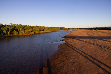 Shadow of Great Northern Highway crossing De Grey River in the Pilbara, Western Australia