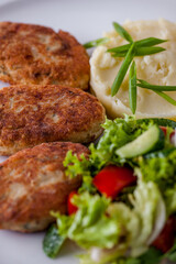 Cutlets with mashed potatoes and salad