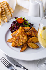 Chops with potatoes and a glass of wine