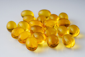 fish oil in omega 3 capsules on a white background