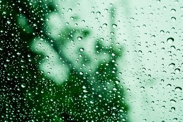 Droplet of water on car mirror, traffic jam
