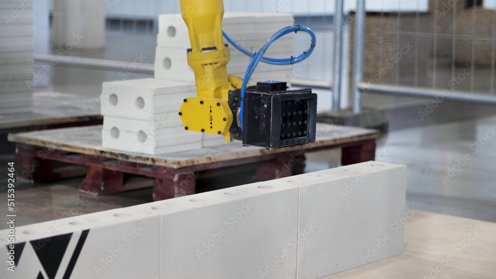 Poster industrial robot exhibit at work. media. bricklayer robot for automated building construction, conce