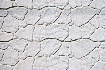 The light white stone wall texture. Background.