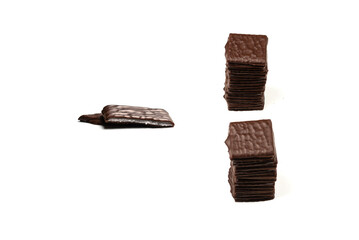 Dark chocolate candies isolated on white background.