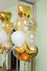 golden and white balloons